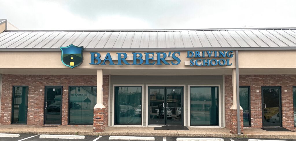 Front of the Barber's Driving School office during the day